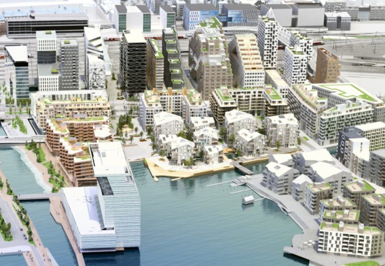 Det er de ni litt ukonvensjonelle bolighusene midt i bildet som nå skal bygges når grunnarbeidene er ferdige. (Illustrasjon: Oslo S Utvikling / Tegnestuen Vandkunsten).