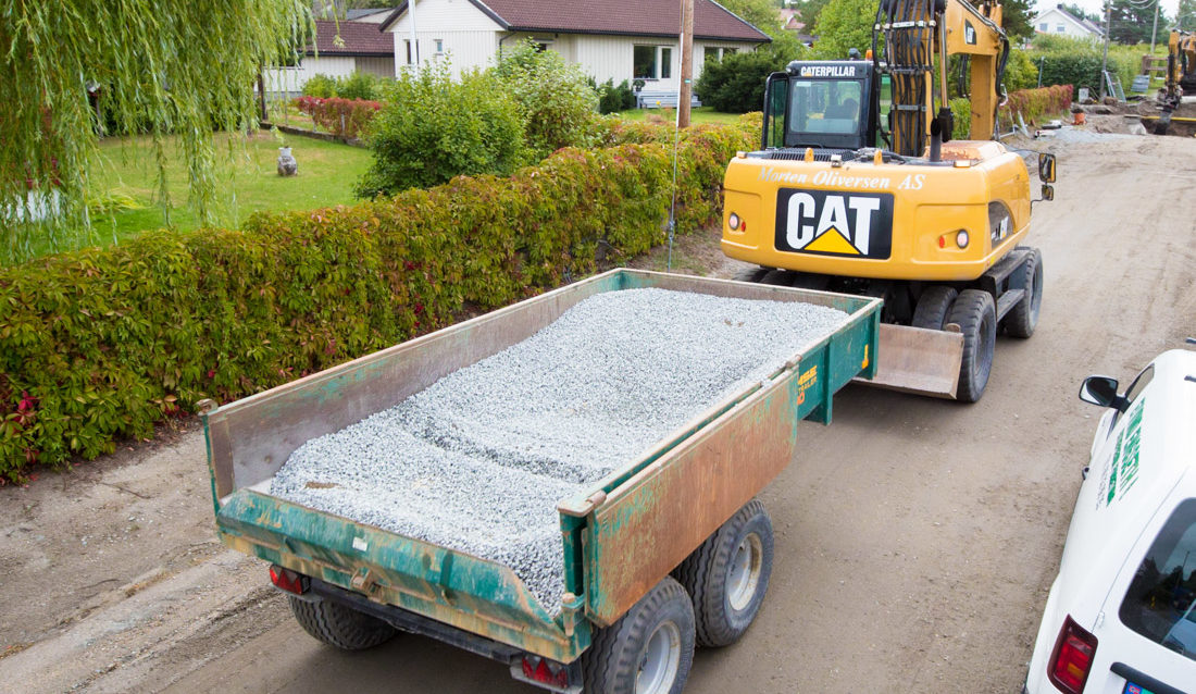 Massetransport på offentlig vei, i henger bak hjulgraver.